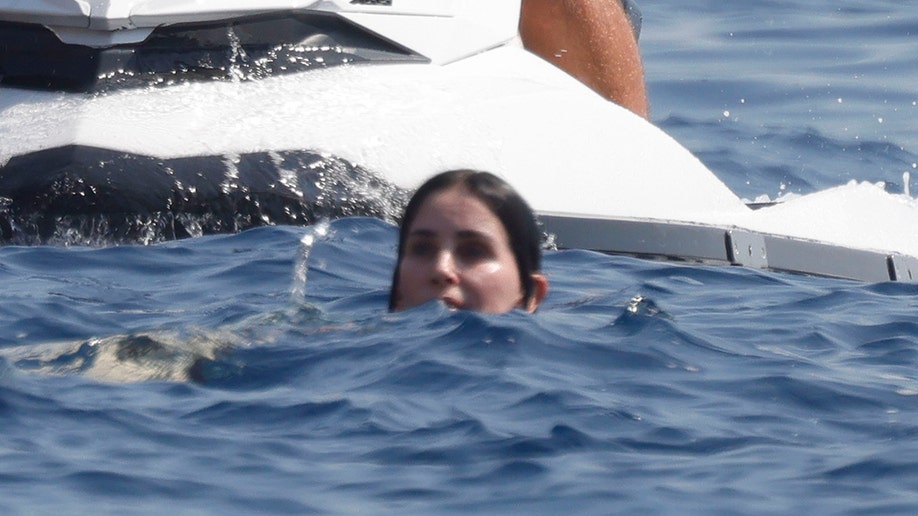Courteney Cox swimming while on vacation in Mallorca.
