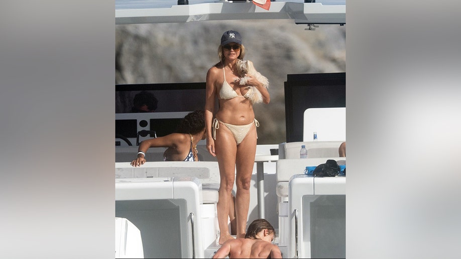 Heidi Klum on a yacht in a cream-colored bikini in St. Barts.