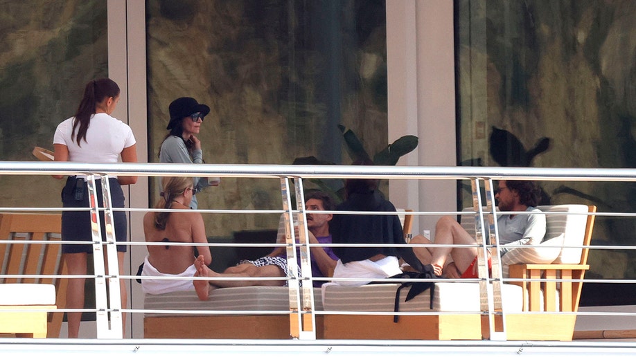 Jennifer Aniston, Courteney Cox and Pedro Pascal on a yacht in Mallorca in July 2026.