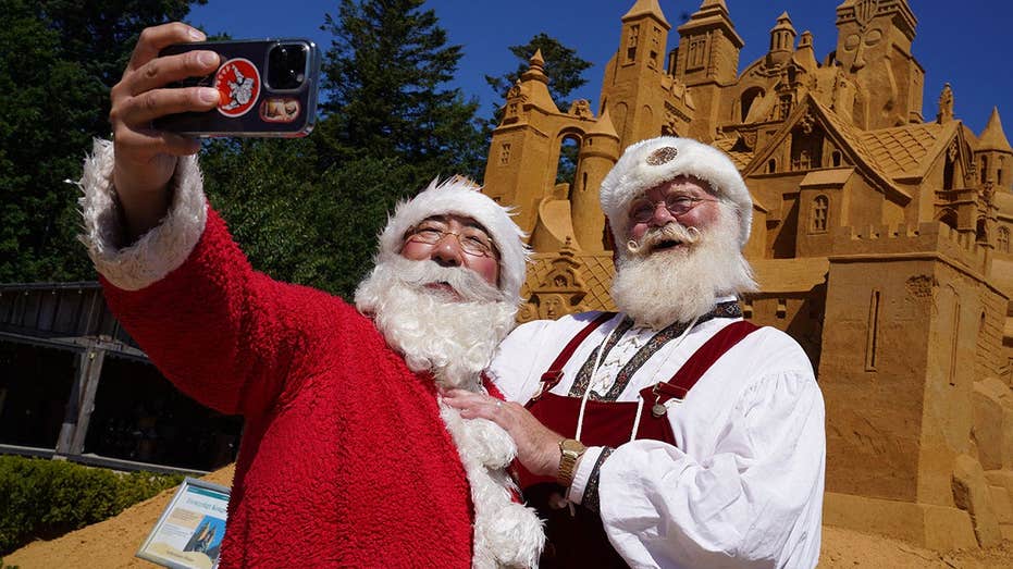 It's Christmas in July as hundreds of Santas go on the march in the middle of a stifling summer heat wave