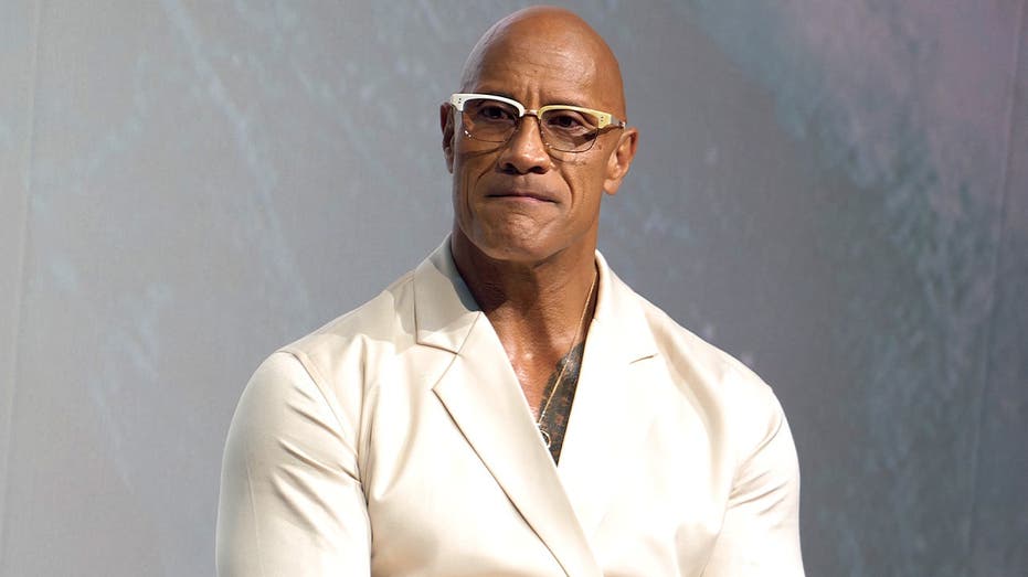 Dwayne 'The Rock' Johnson branded a coward by Hollywood stars after refusing to speak out on politics