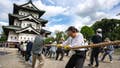 Hundreds of volunteers pull 360-tonne historic Japanese castle back into place by hand - Fox News