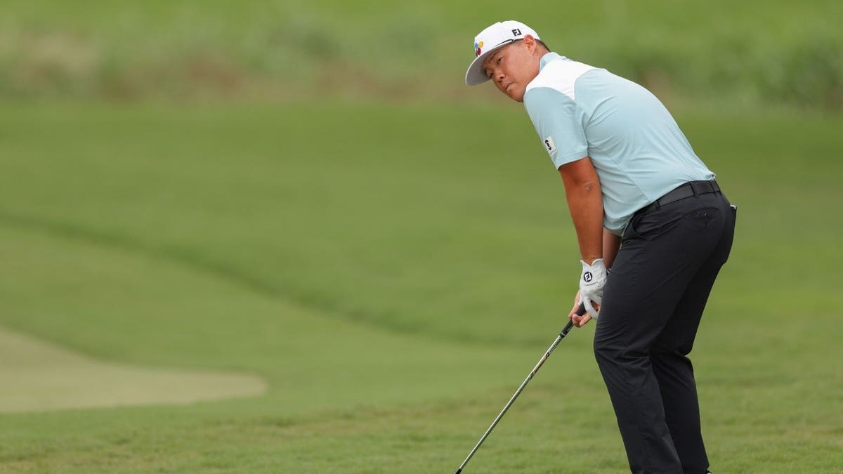 Sungjae Im chips onto the sixth green during the final round of the 2025 Wyndham Championship in Greensboro, North Carolina.