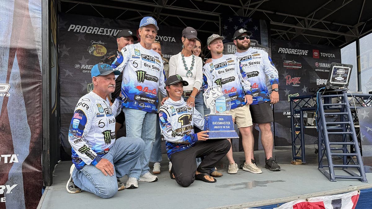 Trey McKinney poses with his friends and family after being named Angler of the Year