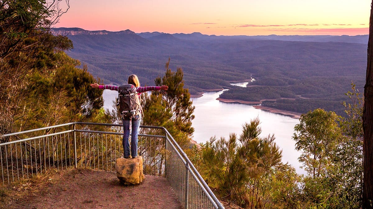 Woman looking at valley in Nattai National Park in Australia