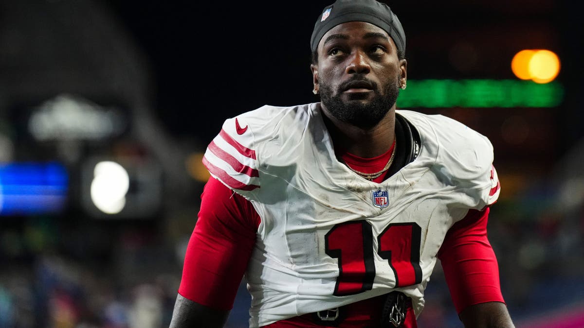 Brandon Aiyuk walks off the field after an NFL game