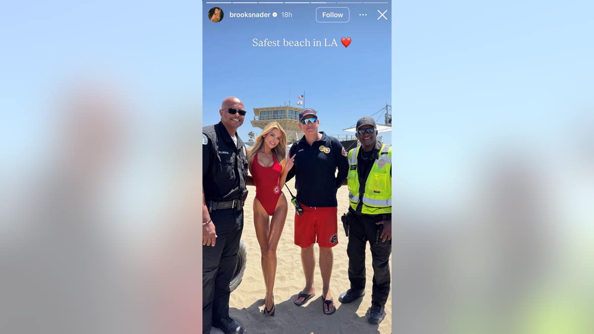 Brooks Nader smiling with crew members.