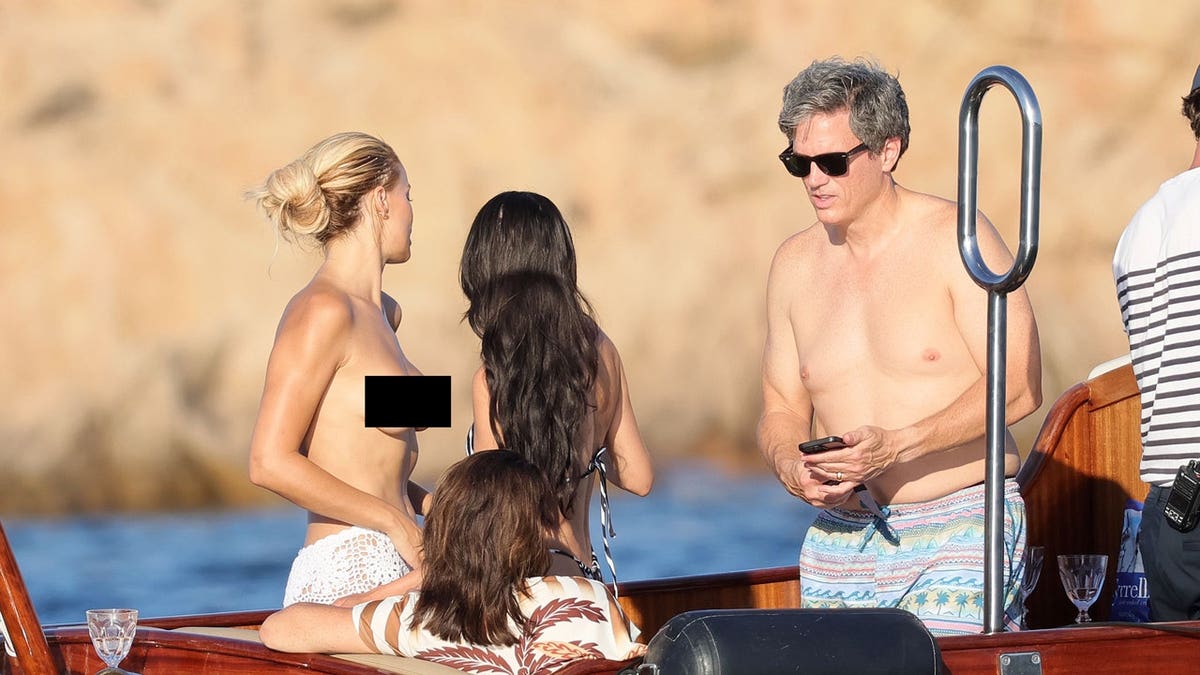 Brooks Nader topless in Italy
