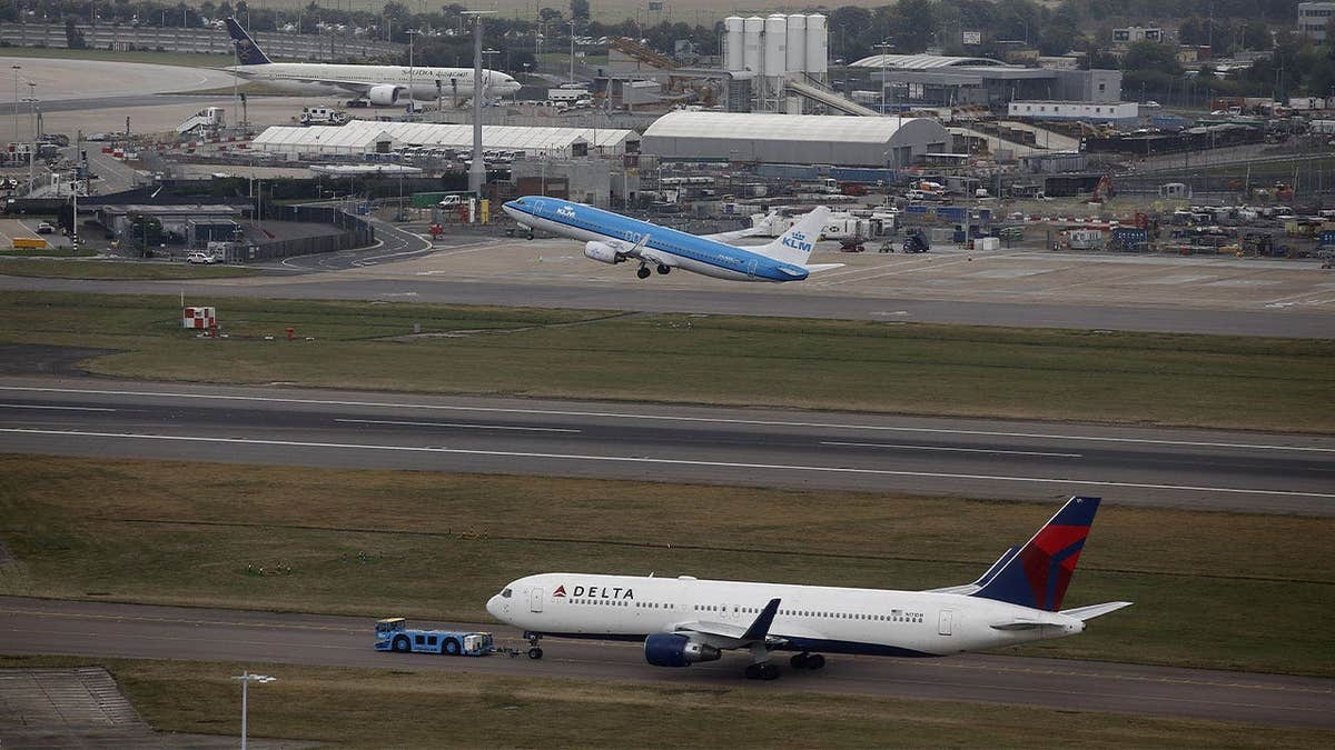 Delta Air Lines aircraft taxis at London Heathrow Airport in London
