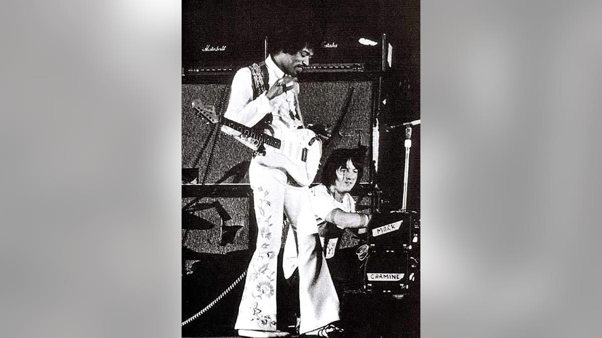 Jimi Hendrix performing next to Eric Barrett at the Hollywood Bowl.