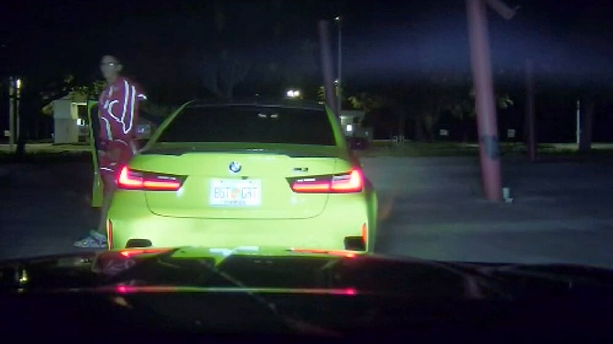 A Florida Highway Patrol dashcam captured Yulian Lugo exiting a green BMW after a high-speed pursuit following an Interstate 75 street takeover.