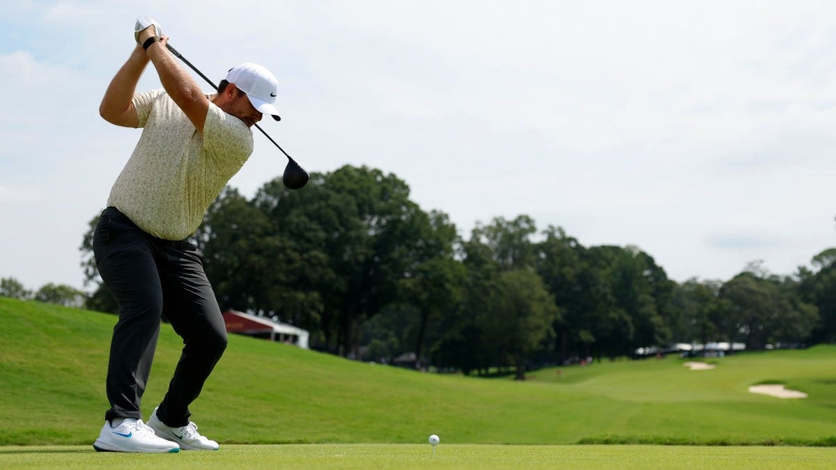Chris Gotterup hits his tee shot during the first round of the 2025 TOUR Championship at East Lake Golf Club in Atlanta, Georgia.