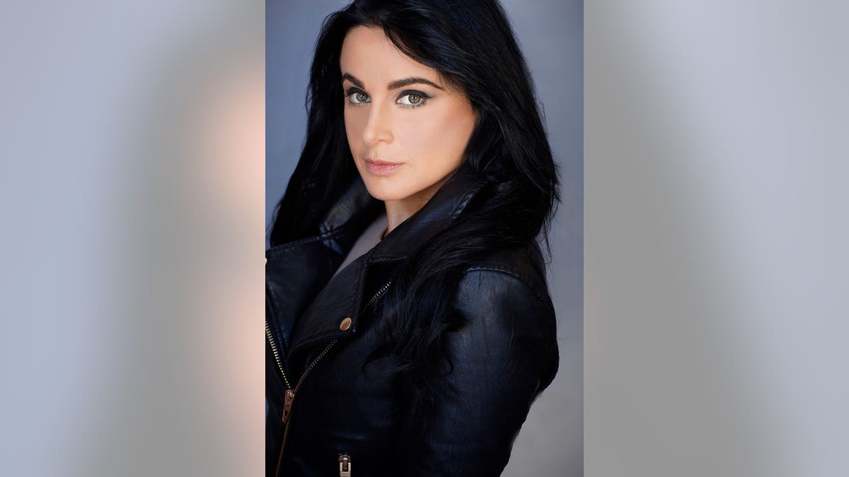 Jennifer Tedmori wearing a black leather jacket.
