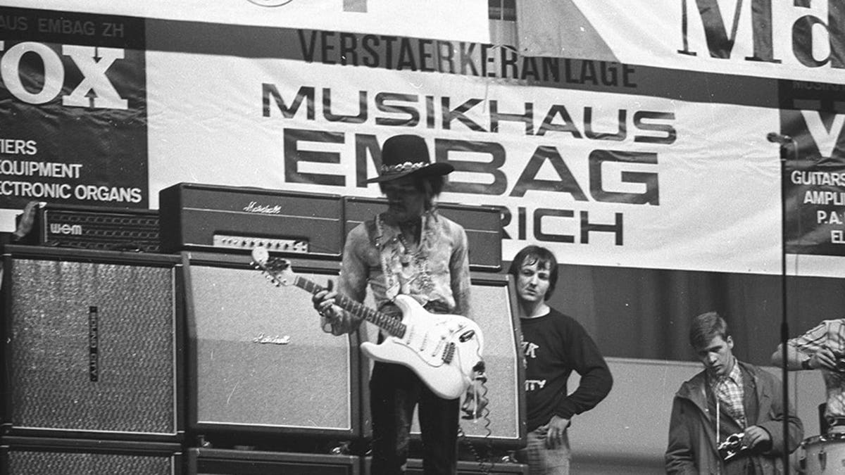 Jimi Hendrix performing in Zurich next to Eric Barrett.