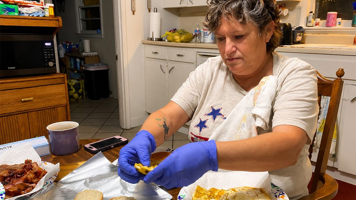 Kathy Kity making breakfast
