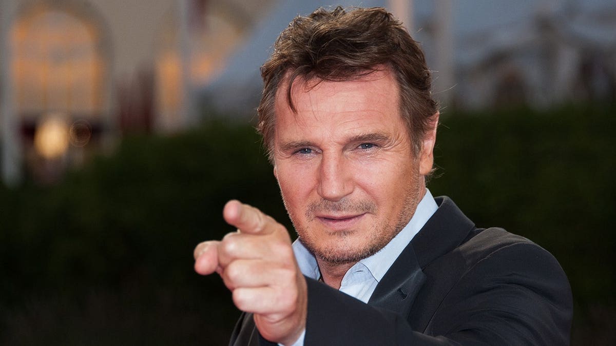 Actor Liam Neeson poses on the red carpet before the screening of his movie