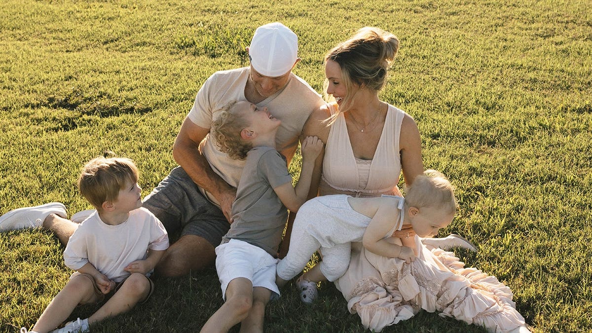 Jade Kircus outdoors with her family.