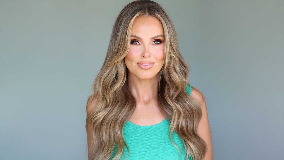 Jade Kircus in a green blouse.