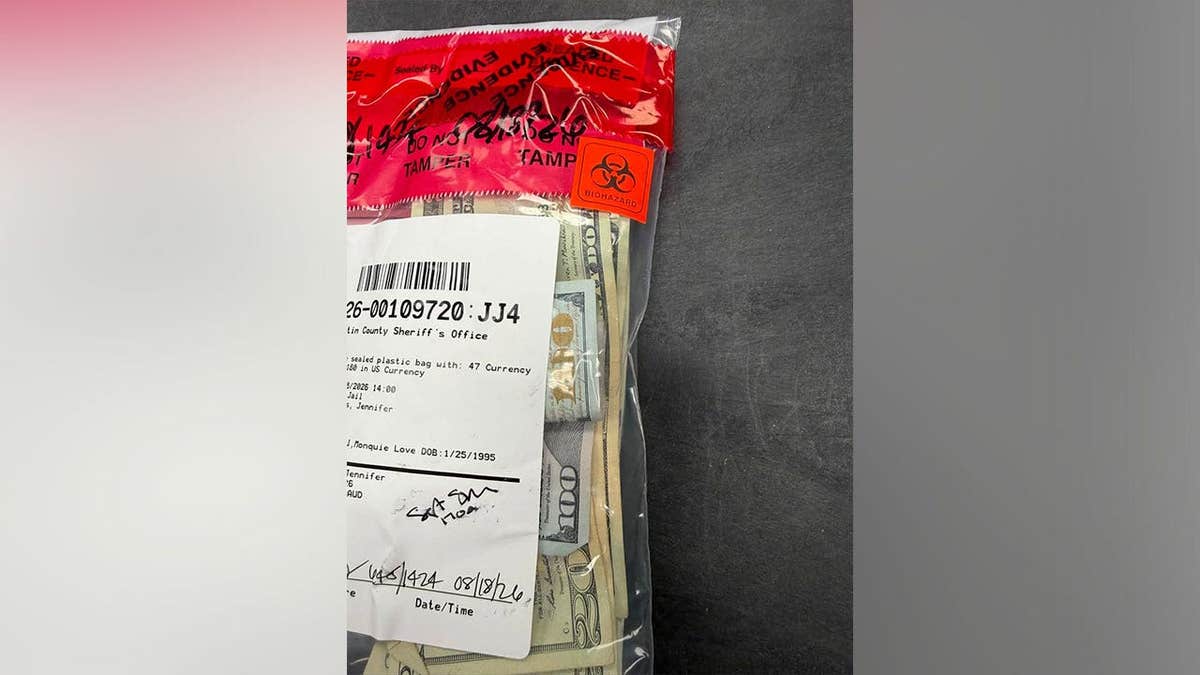 Cash recovered from Moniquie Love Turnbull is sealed in an evidence bag after her arrest in Martin County, Florida
