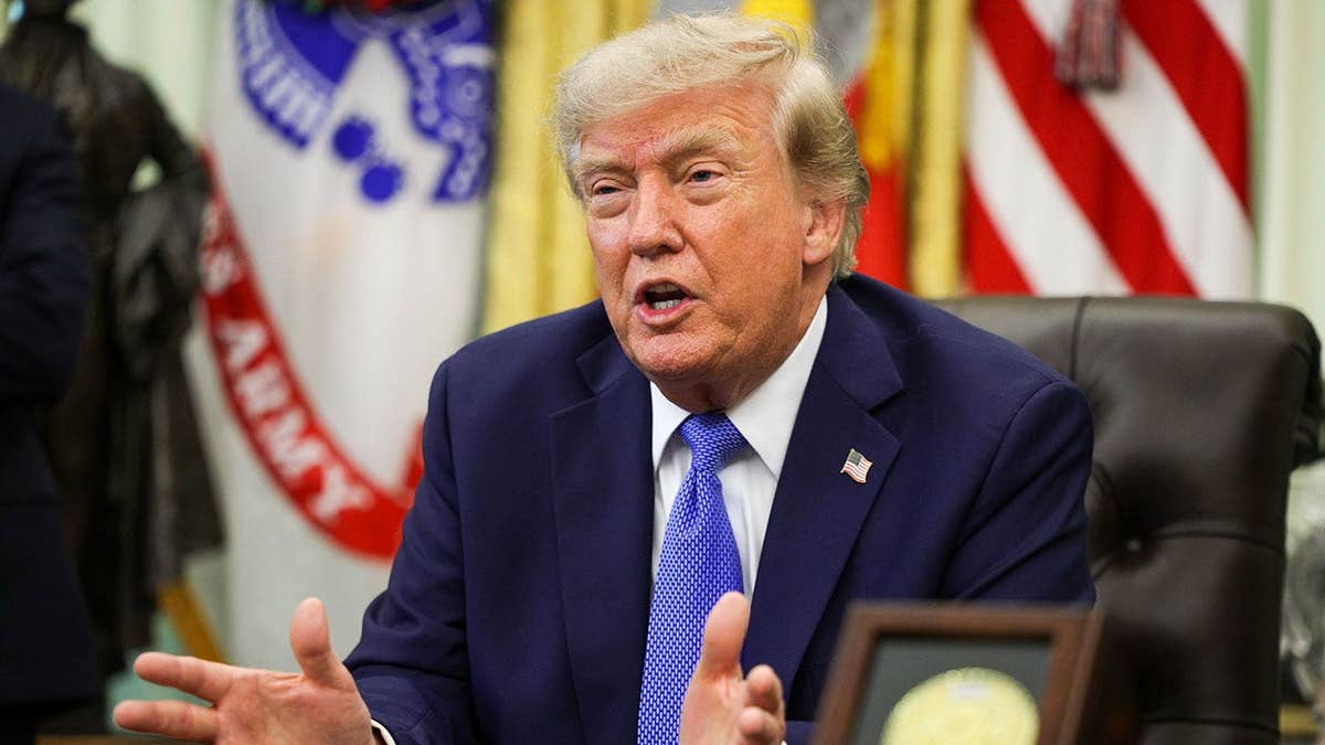 Donald Trump speaks during an event in the Oval Office of the White House.