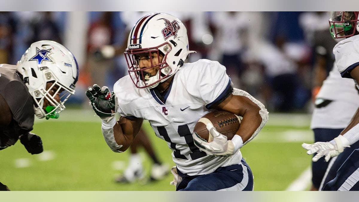 Solomon Beebe carries the football during a game