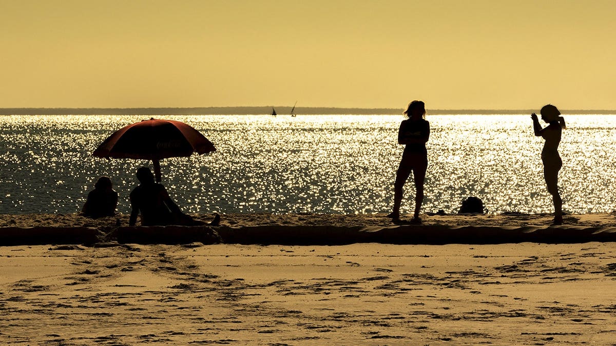 Tourists on beach in Mozambique