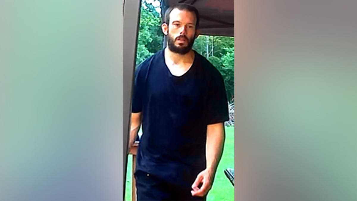 Thomas David Ryan walking in an surveillance image