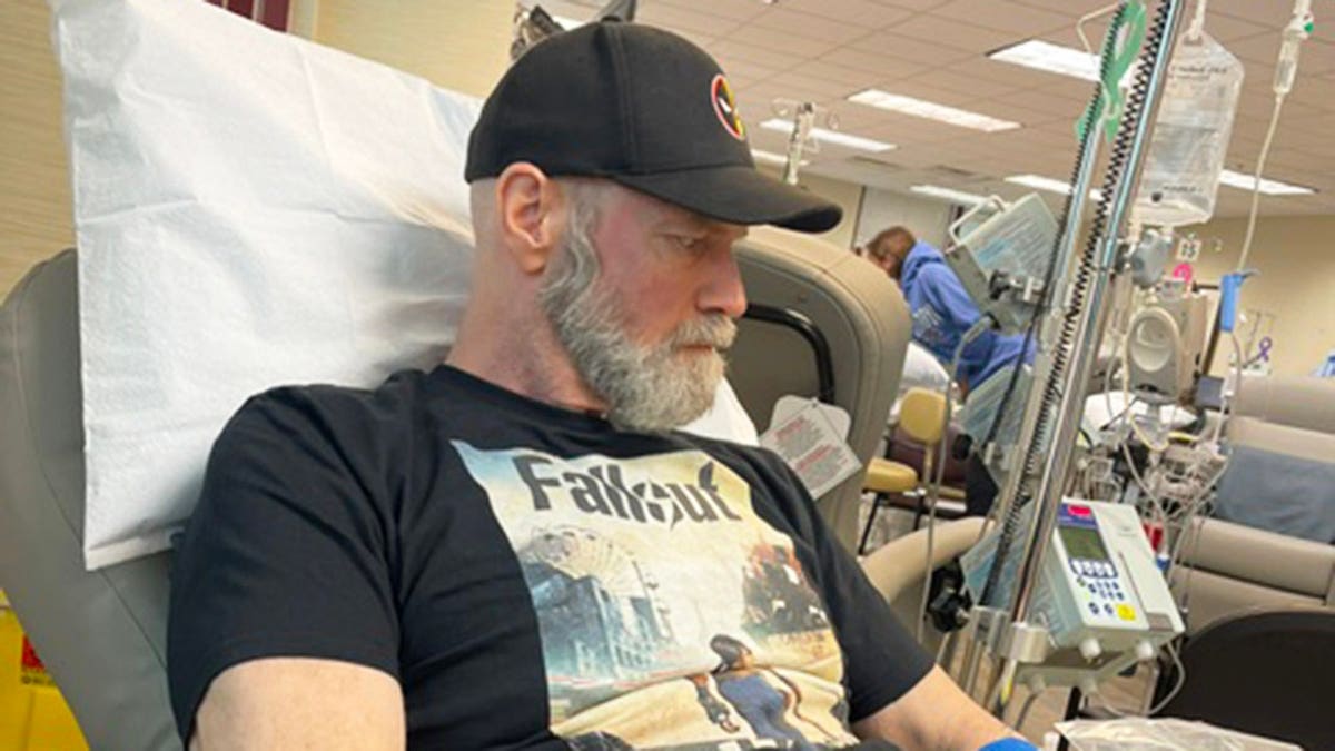 Tyler Mane at a hospital bed getting chemotherapy.