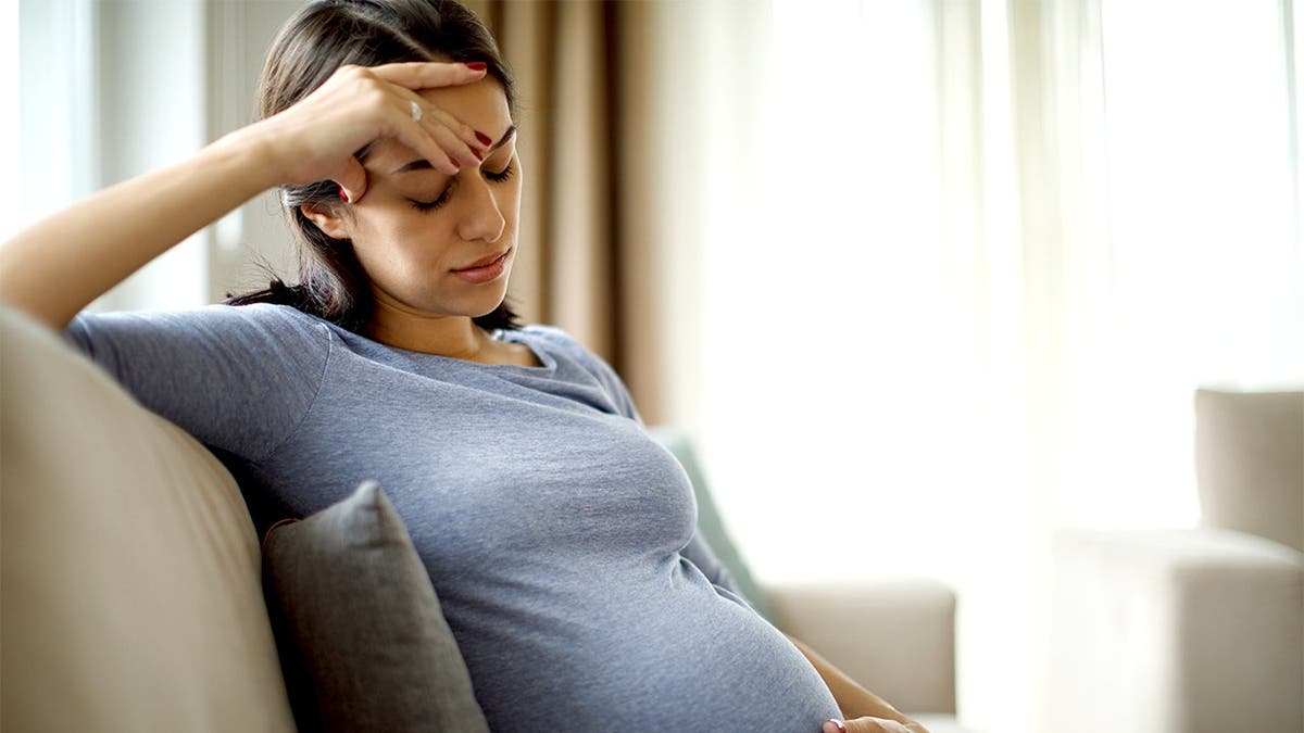 Pregnant woman pictured amid changes to Massachusetts abortion law.