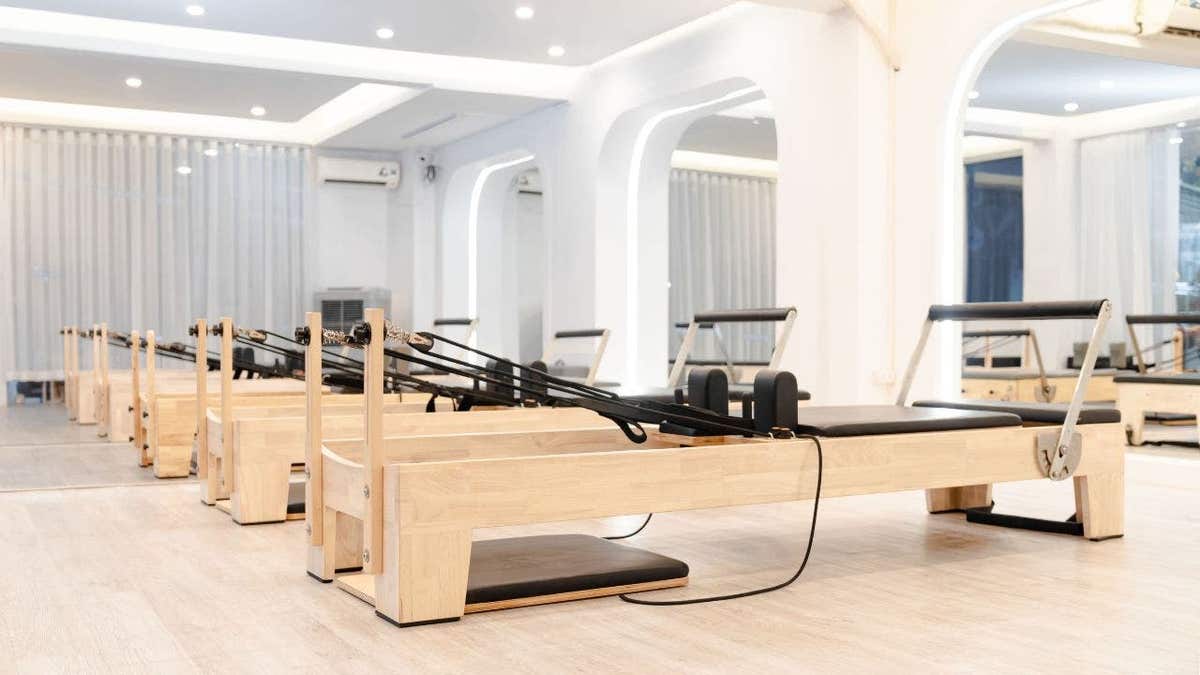 A row of pilates reformers