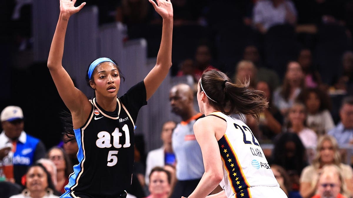 Angel Reese #5 defends during a basketball game against the Indiana Fever at State Farm Arena.
