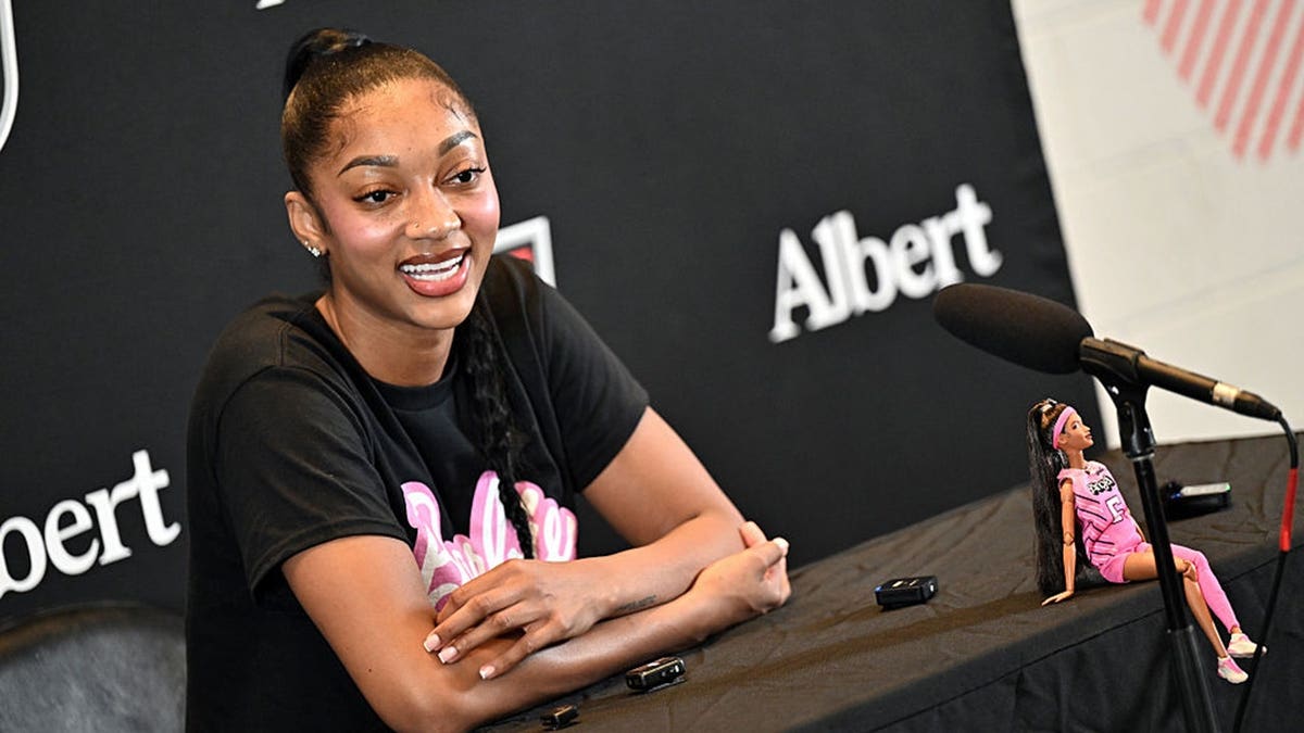 Angel Reese speaks during a press interview before a game.