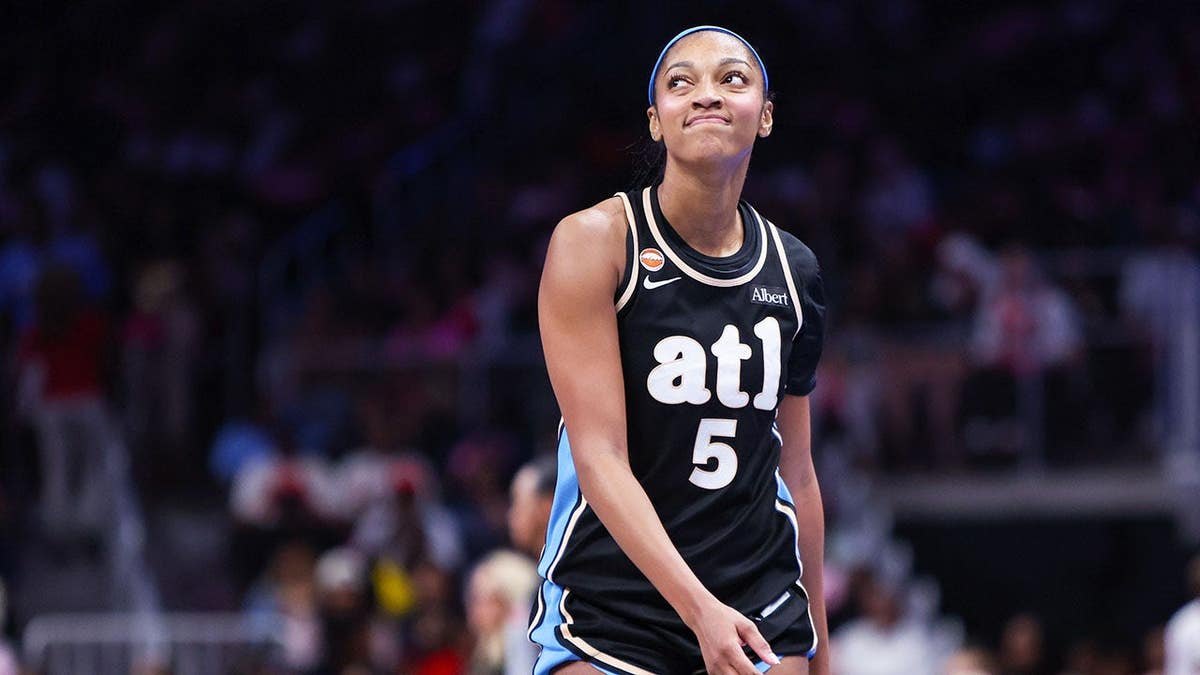 Angel Reese shows emotion during a game against the Las Vegas Aces at State Farm Arena.