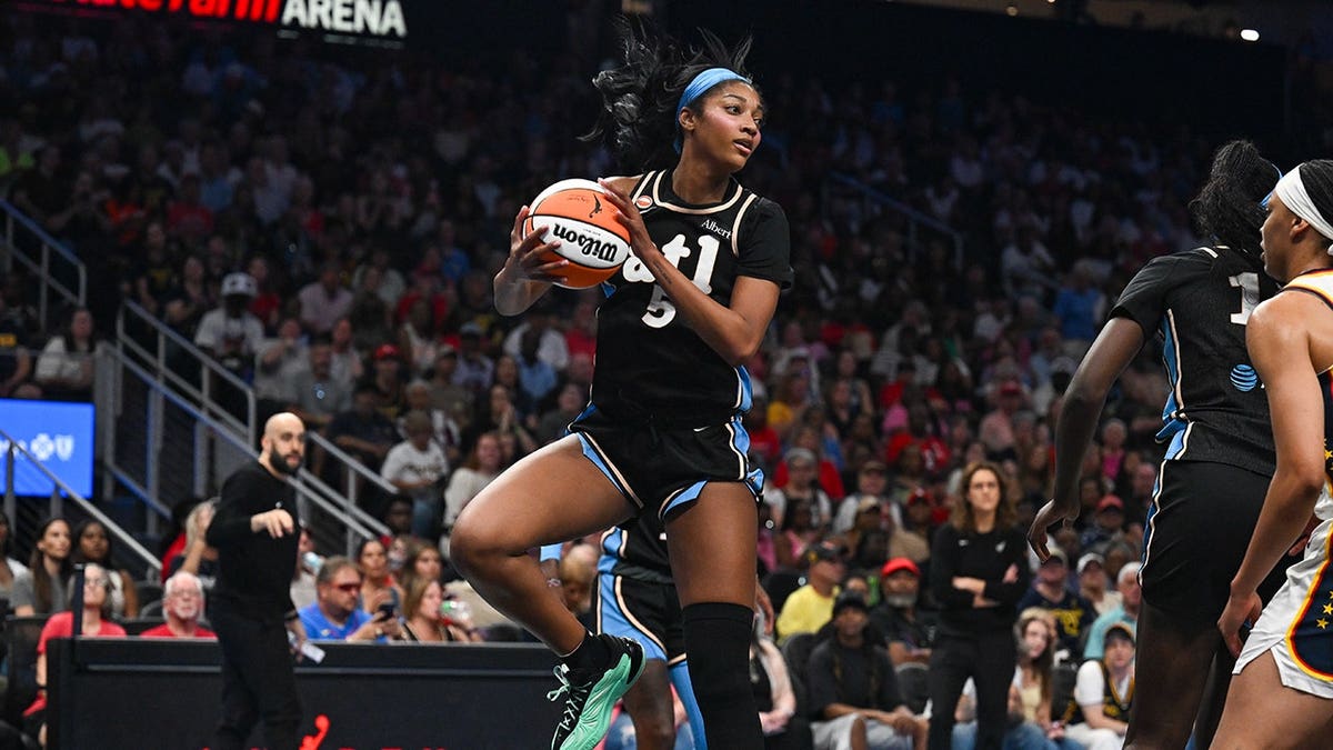 Angel Reese grabs a rebound during a WNBA game in Atlanta.