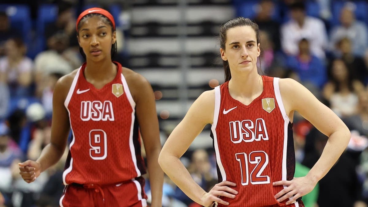 Angel Reese and Caitlin Clark look on during a USA Women's National Team game against Puerto Rico.