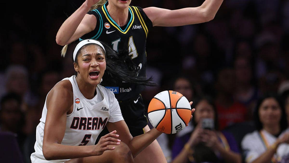 Angel Reese reacts as Cameron Brink defends her during a WNBA game at Crypto.com Arena.