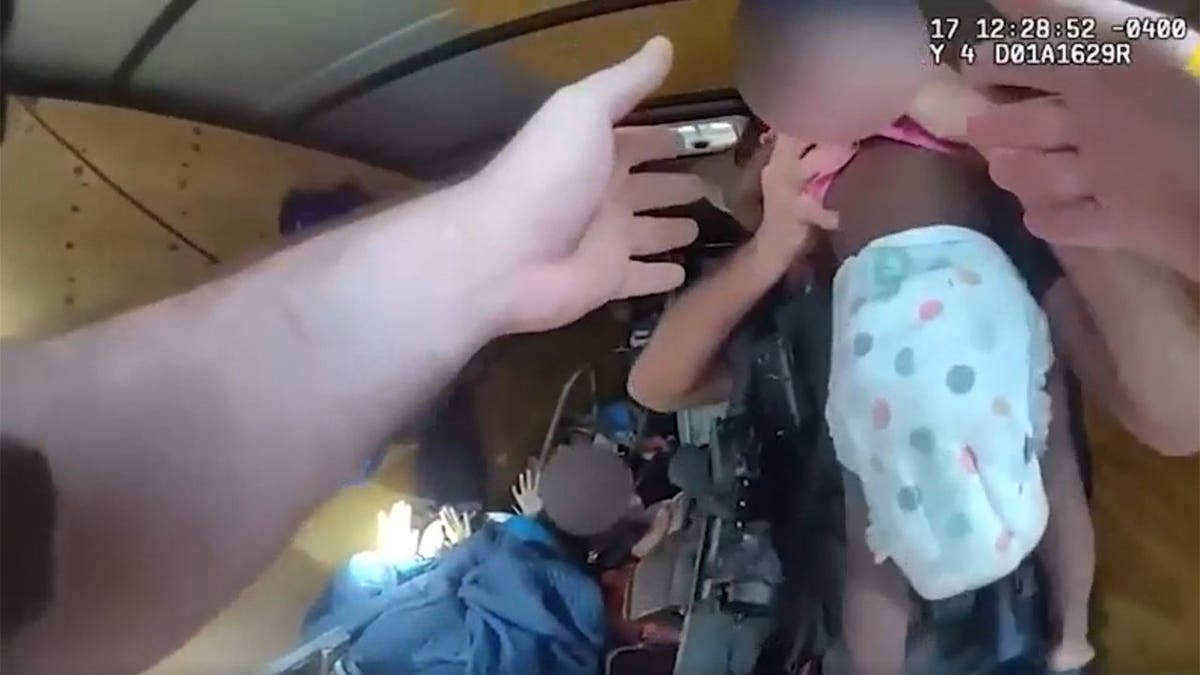 Body camera footage shows two children being rescued from trailer
