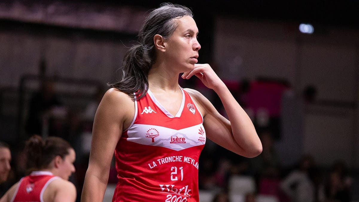 Aurore Pautou drives during a basketball game in Toulouse, France.