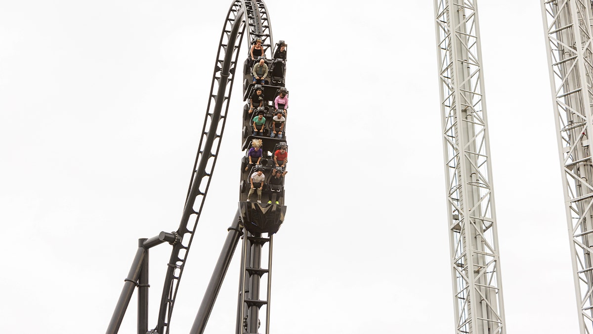 close up of ride with riders going down slope