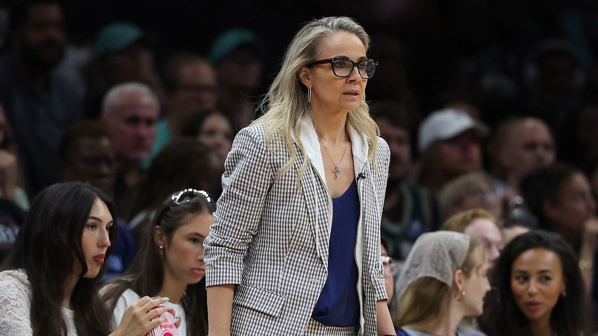 Becky Hammon, head coach of the Las Vegas Aces, looks on during a game.