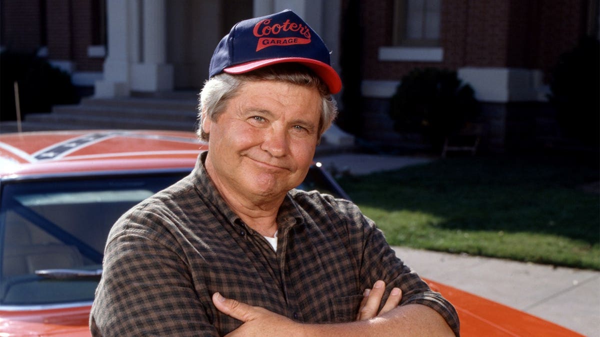 Ben Jones sitting on a car