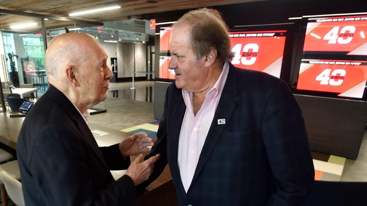 Bill Rasmussen speaks with Chris Berman at ESPN's 40th anniversary celebration.
