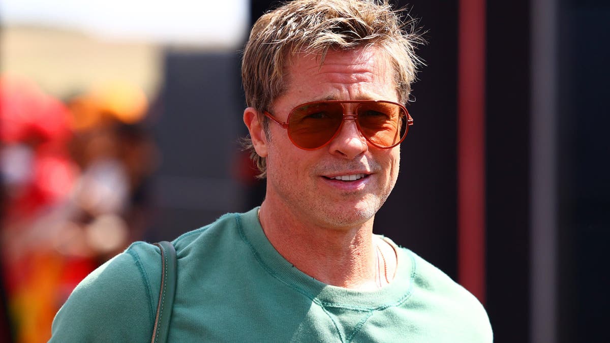 Brad Pitt walks in the paddock at the Hungaroring in Budapest.
