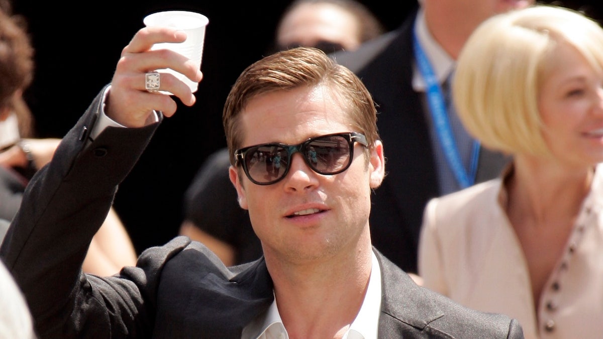 Brad Pitt holding wine glass
