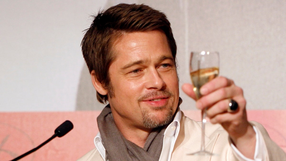 Brad Pitt raising wine glass