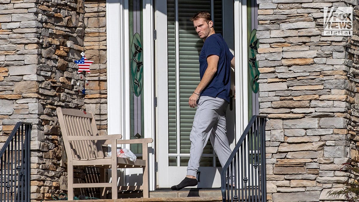 Full shot of Brian Hickerson walking out of a home in Greenville, SC on Sunday, Aug. 23, 2026