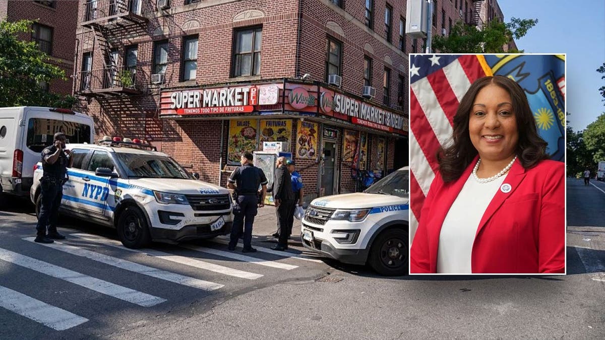 Police official in front of NYPD vehicles