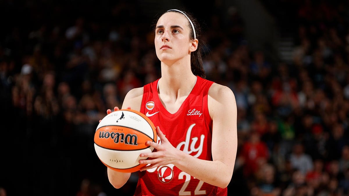 Caitlin Clark shoots a free throw during a game in Portland.