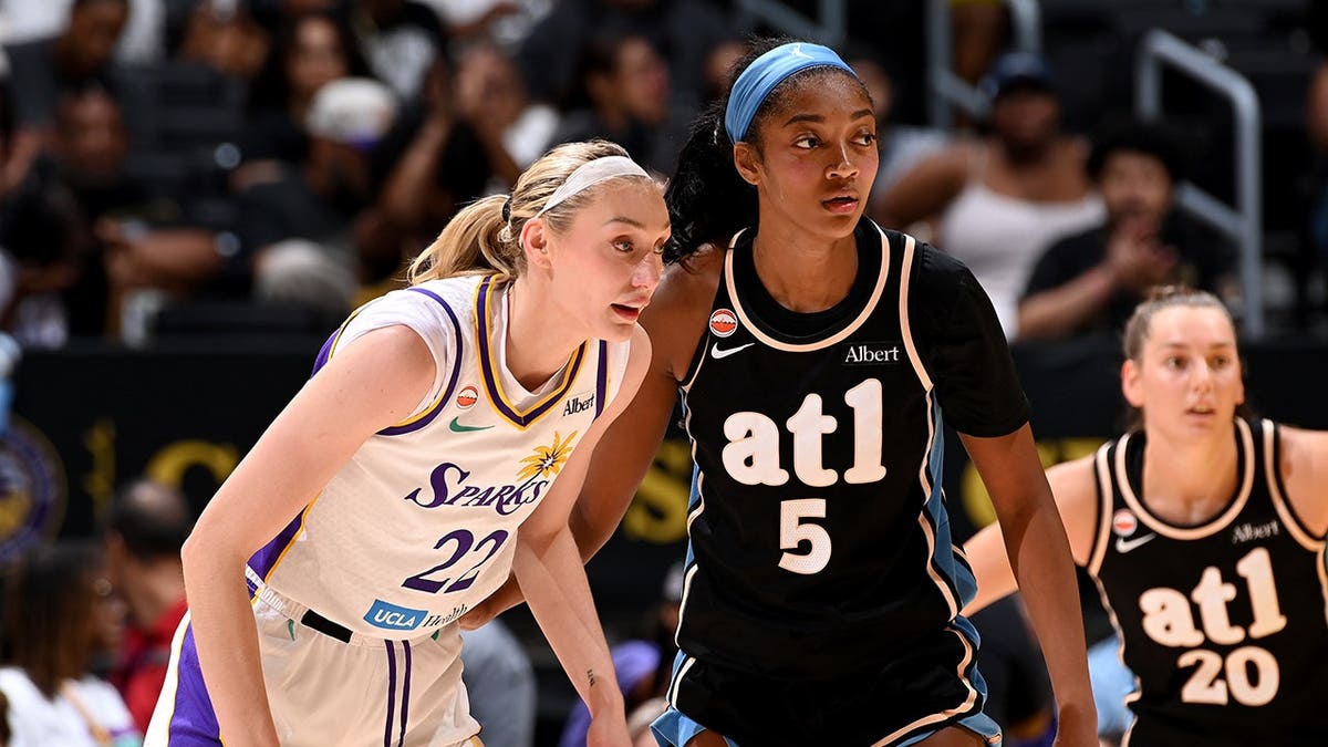 Cameron Brink and Angel Reese look on during a WNBA game at Crypto.com Arena.
