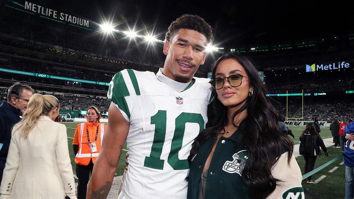 Camila Escribens meets Allen Lazard at MetLife Stadium.